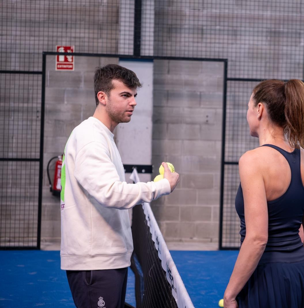 Coach giving a padel lesson